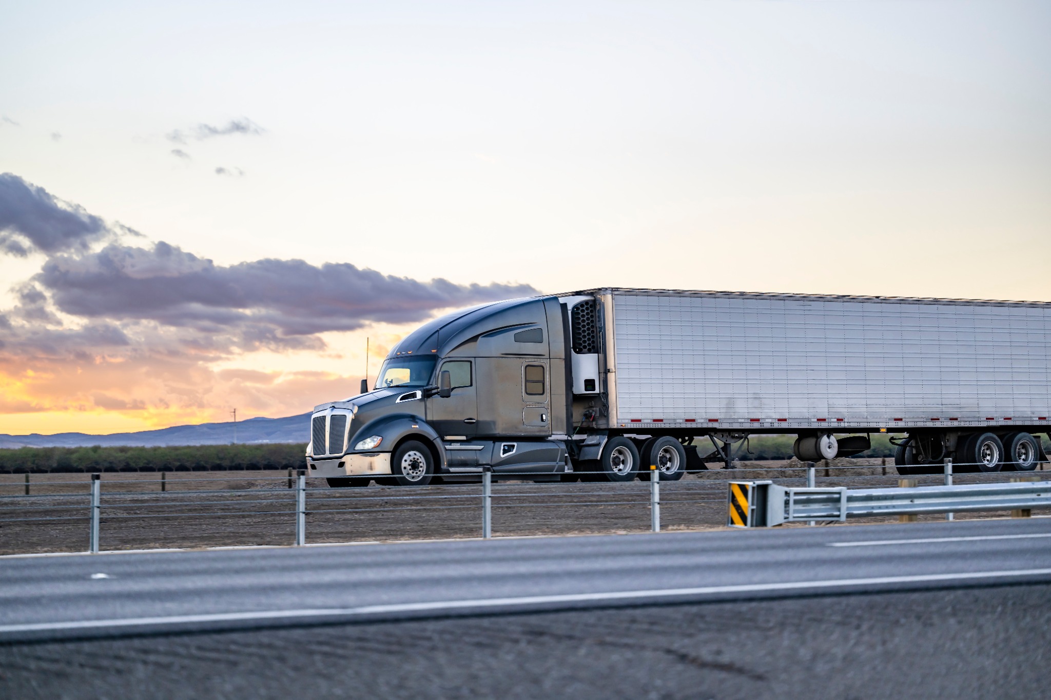 Grey truck at sunset